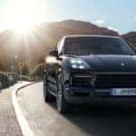 Porsche driving down the road