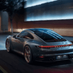 2019 Porsche 911 Carrera S driving down a city street at night