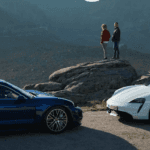 Two 2021 Porsche Cayenne models parked facing each other