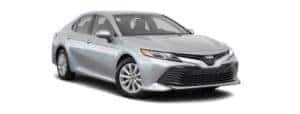 A silver 2020 Toyota Camry is facing right.