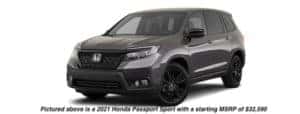 A dark grey 2021 Honda Passport Sport is angled left.