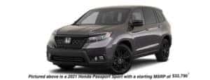 A dark gray 2021 Honda Passport is angled left.