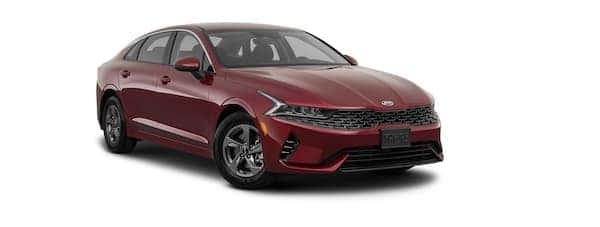 A red 2021 Kia K5 is angled right.