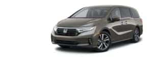 A dark grey 2021 Honda Odyssey is angled left.
