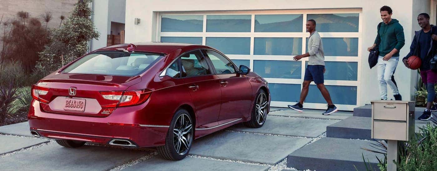 A red 2021 Honda Accord is shown from the rear at an angle.