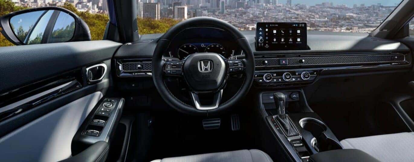 The black dash is shown in a 2025 Honda Civic.