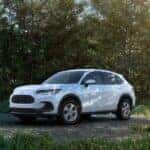 A white 2025 Honda HR-V parked off-road.