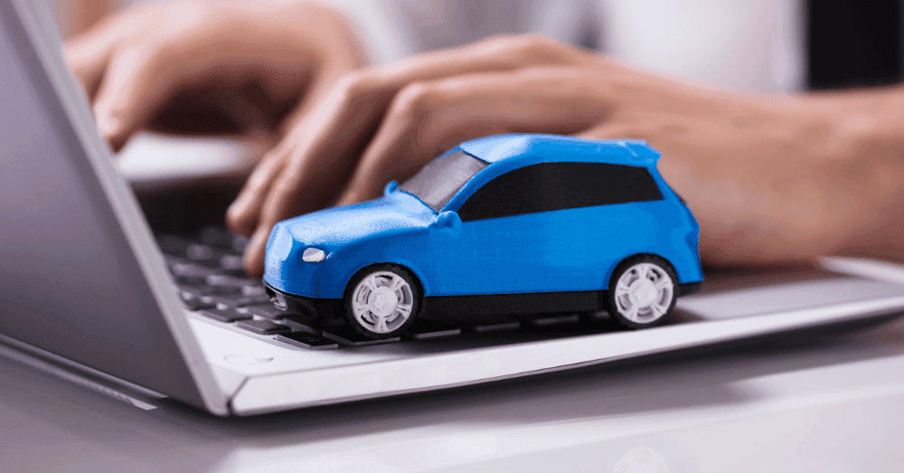 How to Sell a Used Car in Indiana - blue toy car on a computer