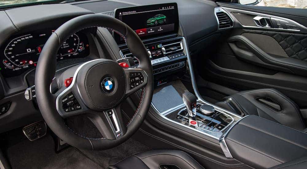 The black interior of a 2023 BMW M8 Competition Gran Coupe is shown.