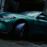A green 2024 BMW M3 Sedan is shown parked near a BMW M Certified dealer.