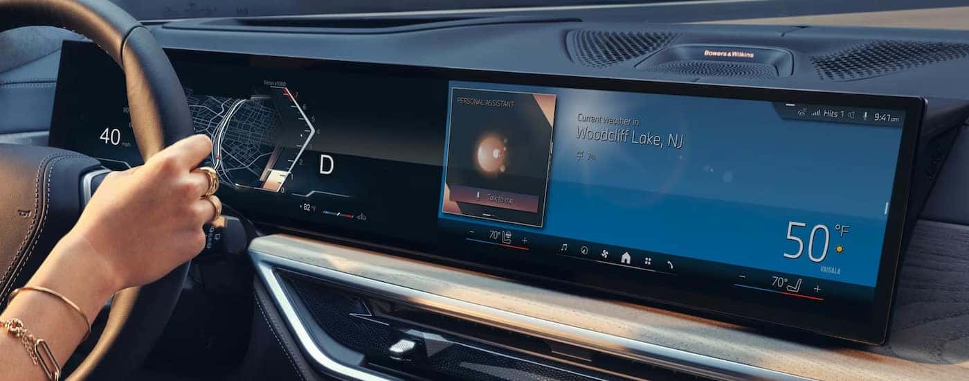 The curved infortainment screen and digital dashboard in a 2024 BMW at a BMW dealer near Dallas.