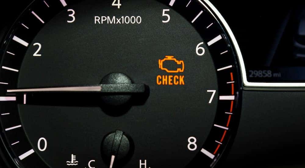 A check engine light is shown illuminated.