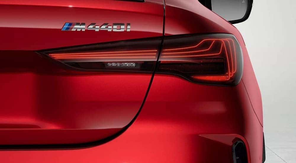 A close up of the brakelight on a red 2025 BMW M440i Coupe.