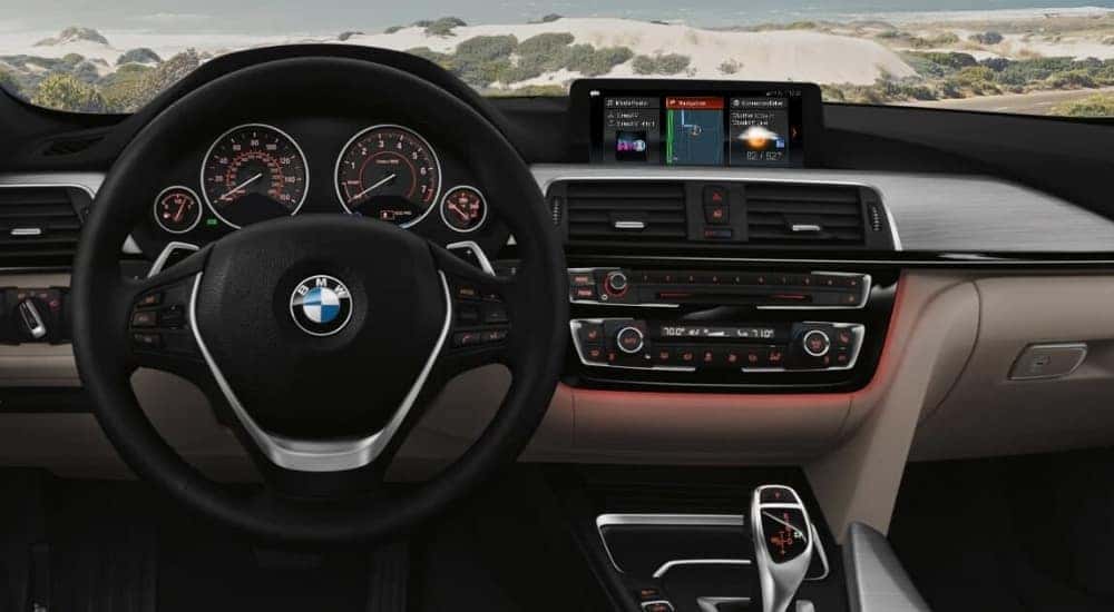 A gray and black interior and dash in a 2019 BMW 3 Series Gran Turismo is shown.