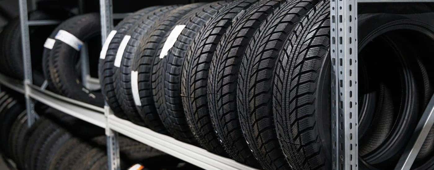 Tires are shown on a tire rack.