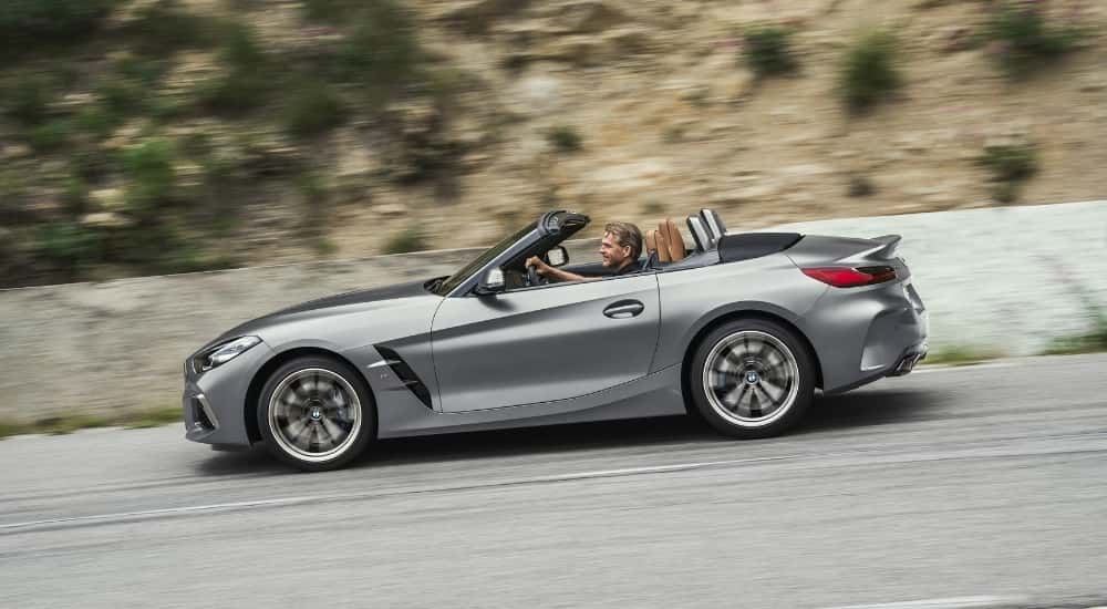 A grey 2021 Certified Pre-Owned BMW Z4 is shown from the side.
