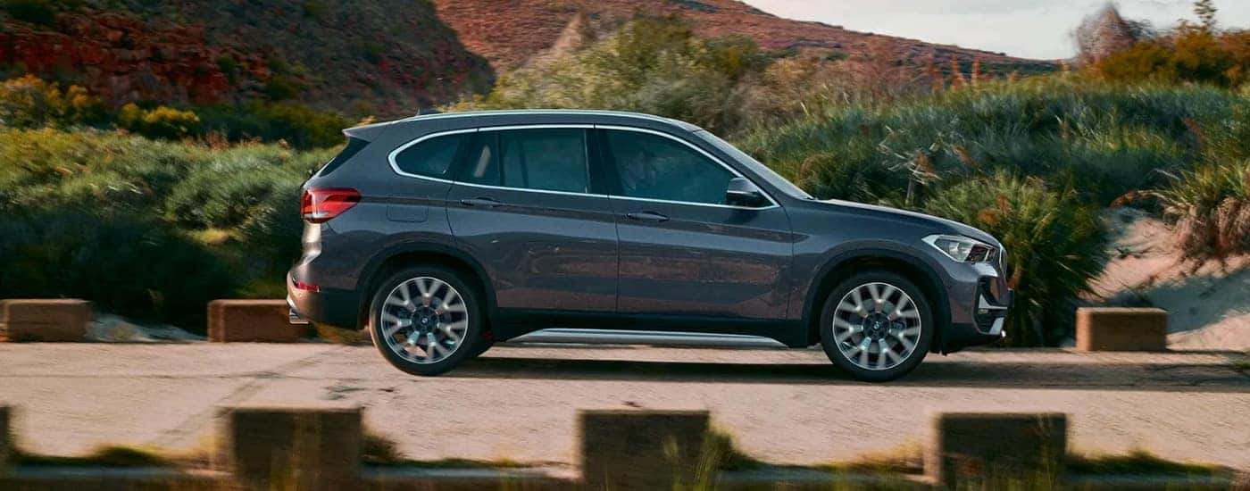 Grey 2020 BMW X1 driving