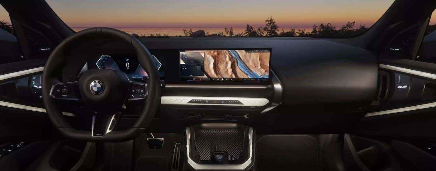 Steering wheel and dashboard inside a 2025 BMW X3.