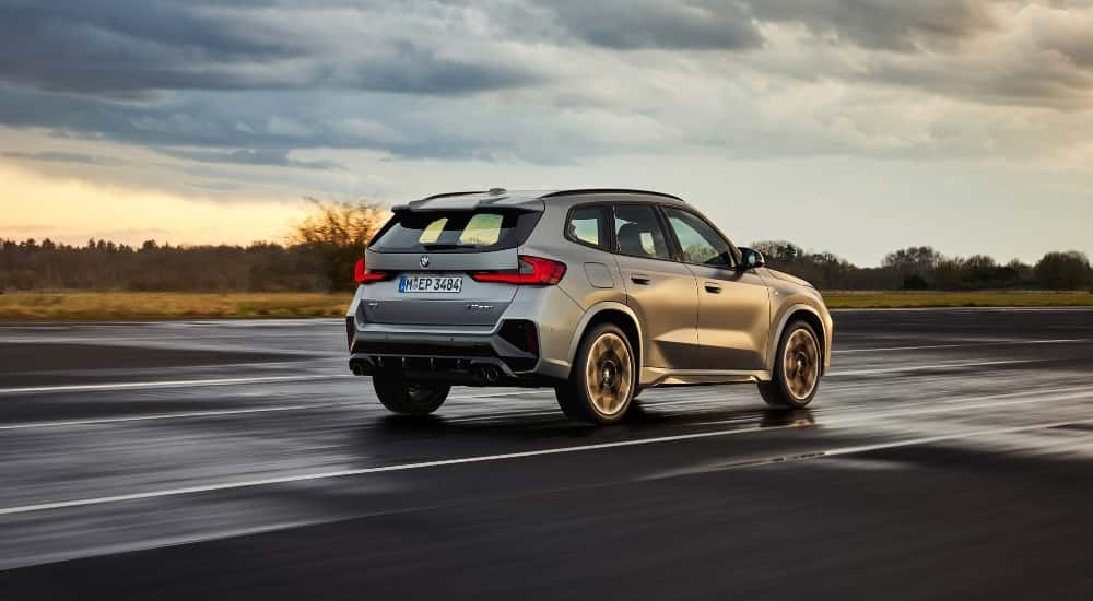 A silver 2025 BMW X1 for sale from the rear at an angle.
