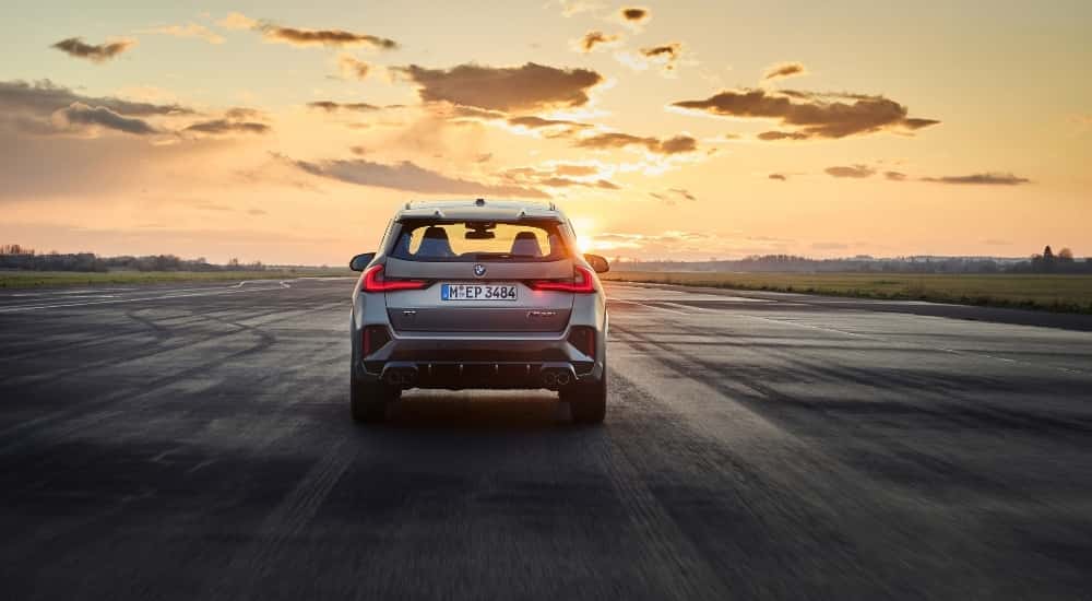 A silver 2025 BMW X1 M35i from the rear.