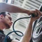 mechanic rotating tires