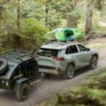 2019 toyota rav4 with kayak rack and towing camper through woods