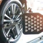 A close up is shown of a wheel and the alignment target.