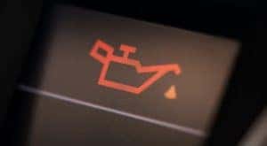The check oil light is illuminated in a vehicle.