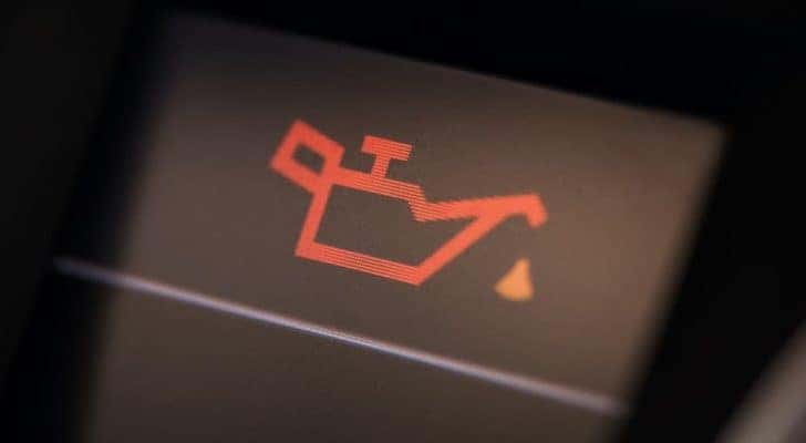 The check oil light is illuminated in a vehicle.