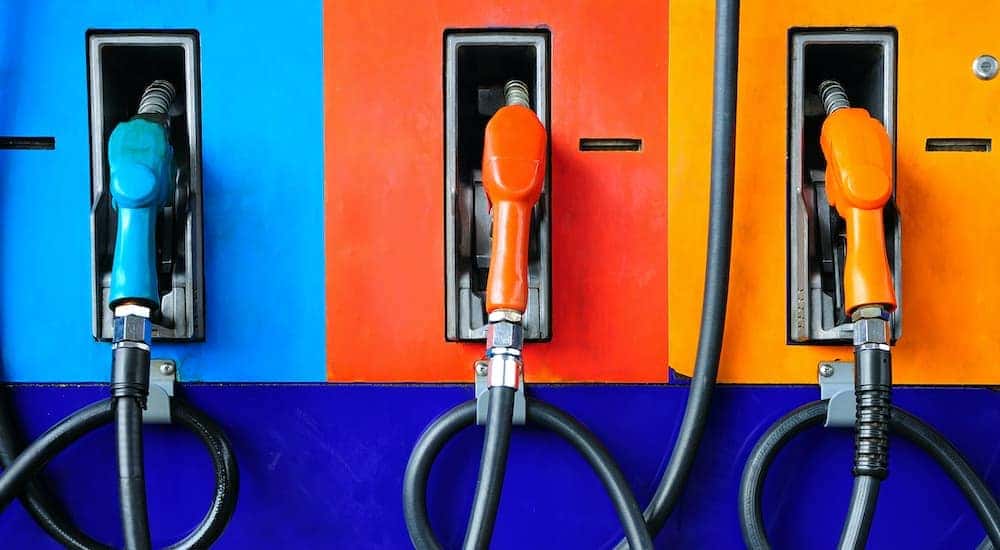 Multicolored gas pumps are shown.