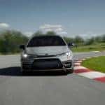 A grey 2022 Toyota Corolla XSE Apex Edition is shown driving on a race track after leaving Naperville Toyota dealer.