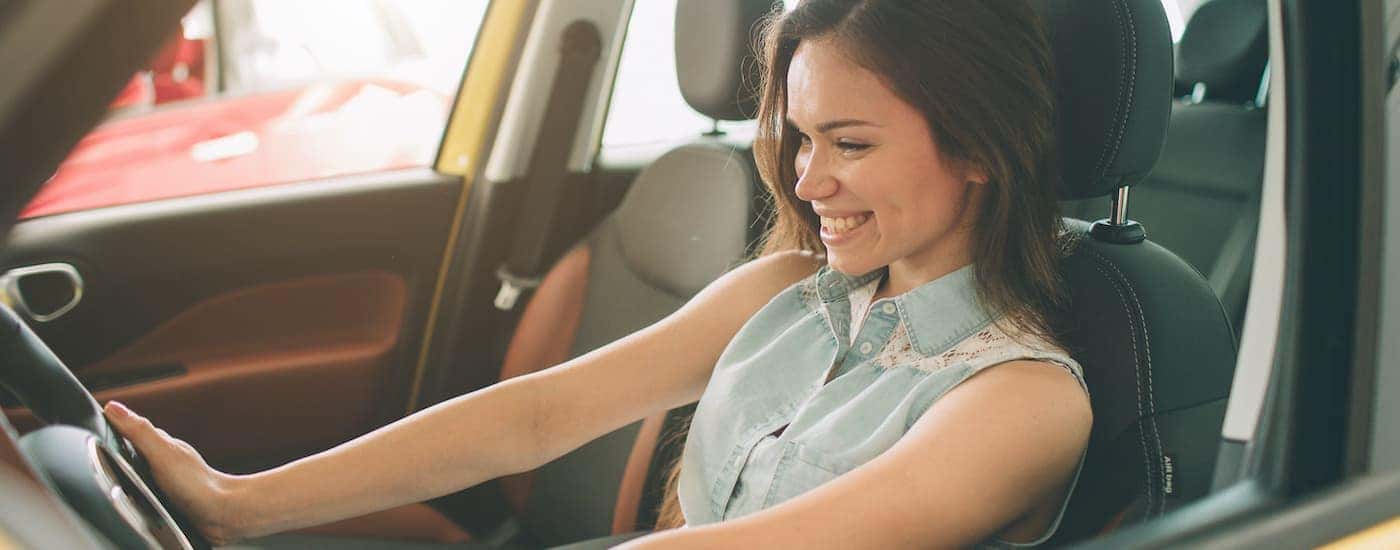 A woman is shown driving a vehicle are successfully searching how to value your trade.