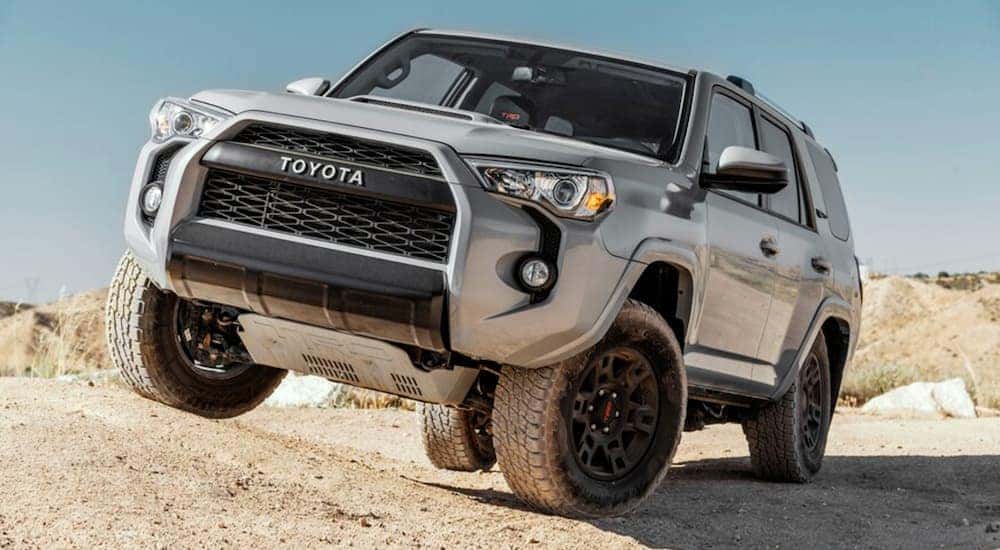 A grey 2022 Toyota 4Runner is shown from the front while driving off-road after getting Toyota SUV service performed on it.