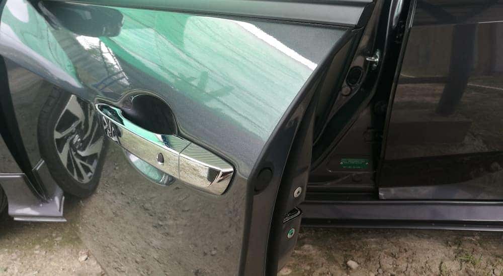 A car door is shown at a Toyota collision center.