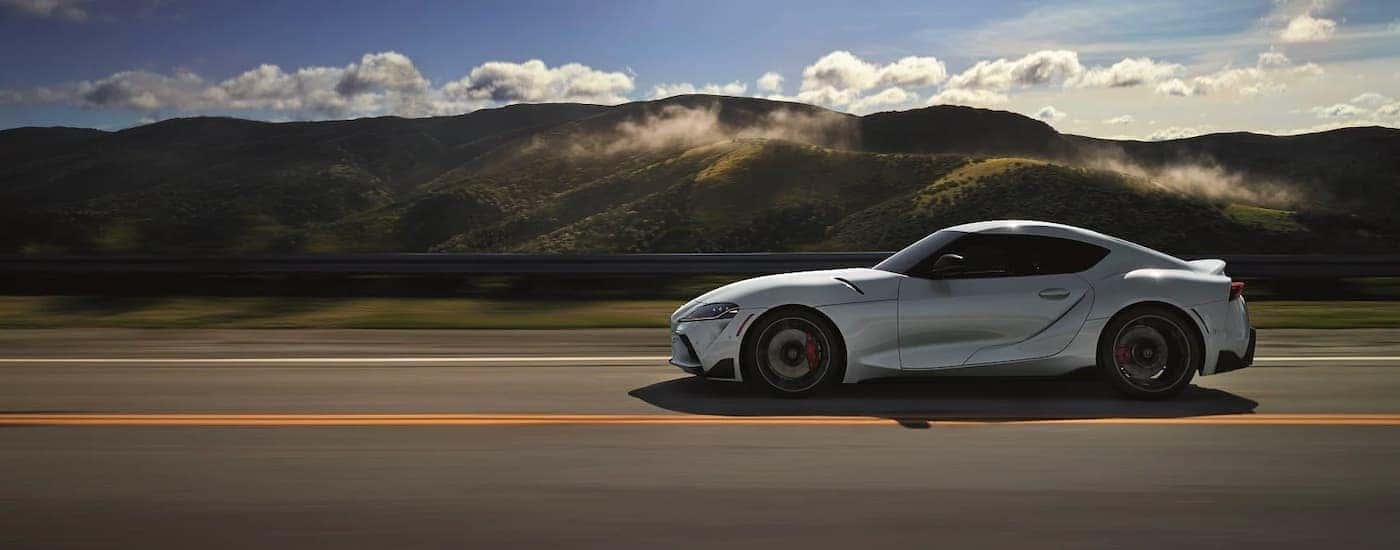 A white 2020 Toyota GR Supra is shown from the side after leaving a Toyota dealership near you.