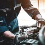 A glove mechanic is shown working on a vehicle at a service center near you.