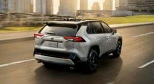 A grey 2020 Toyota RAV4 is shown from the rear at an angle.