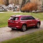 A red 2023 Toyota Sequoia is shown from the rear at an angle.