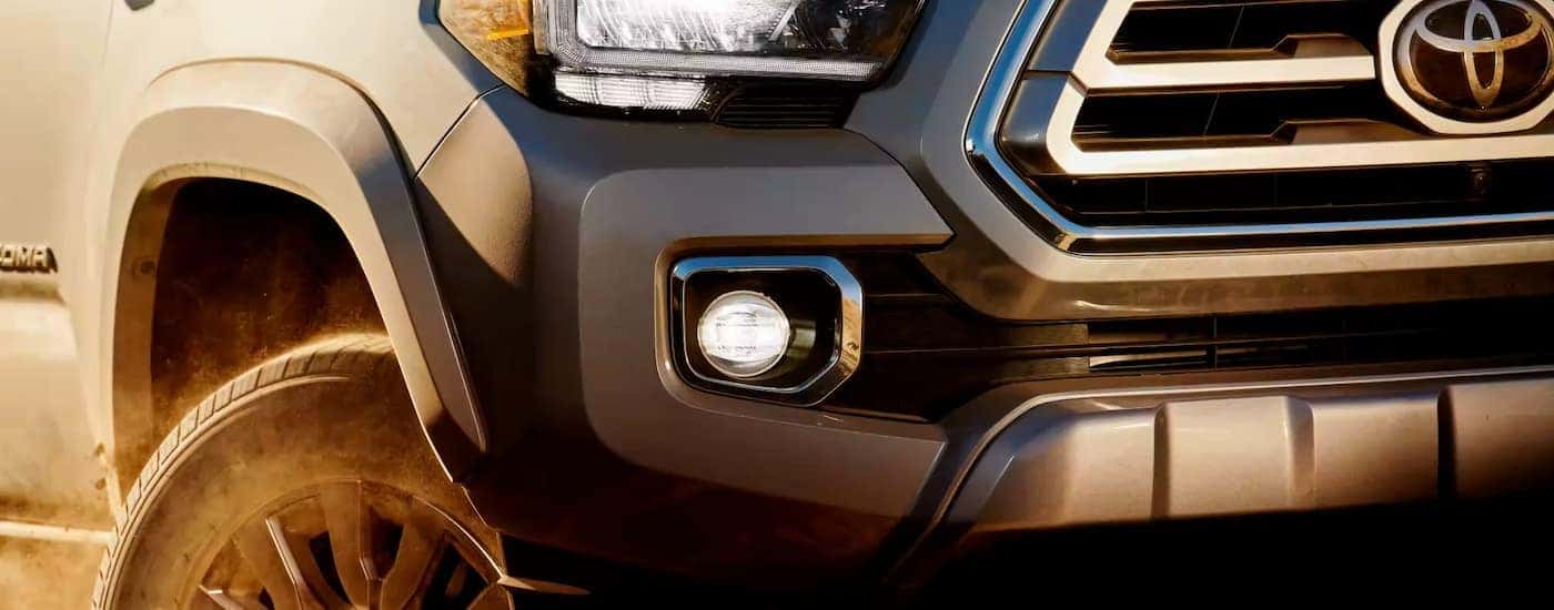 A close up of a grey 2023 Toyota Tacoma is shown after leaving a Toyota service center near Darien, IL.