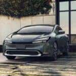 A grey 2023 Toyota Prius Prime XSE Premium is shown charging.