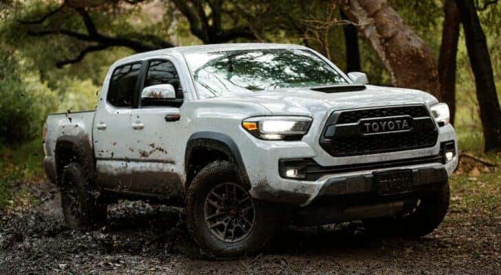 A white 2021 Toyota Tacoma TRD Pro is shown from the front at an angle after leaving a dealer that has a Toyota Tacoma for sale.