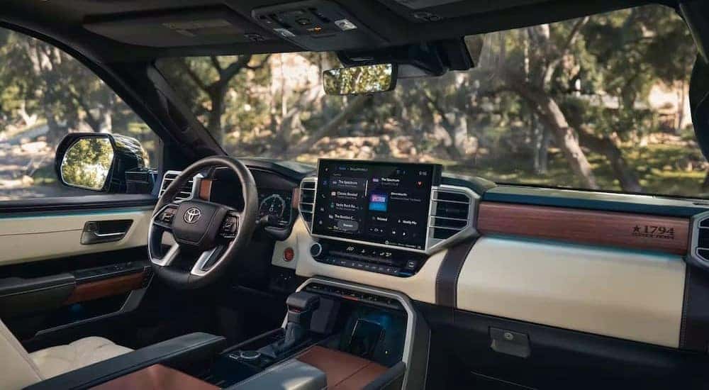 The black, brown and tan interior and dash of a 2024 Toyota Tundra is shown.
