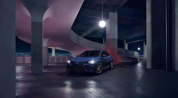 A blue 2023 Toyota Camry Nightshade is shown from the front at an angle.