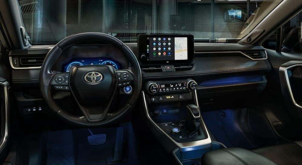 The black interior and dash of a 2024 Toyota RAV4 is shown.