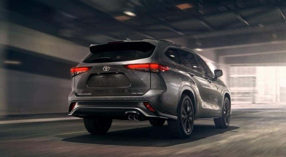 A silver 2024 Toyota Highlander XSE is shown driving in a tunnel.