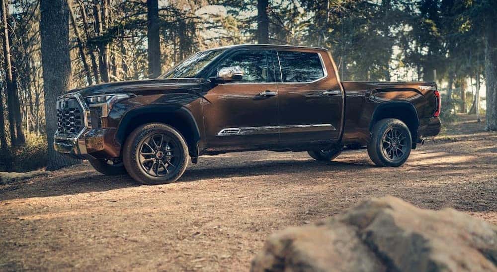 A brown 2024 Toyota Tundra 1794 is shown parked off-road after visiting a Toyota Tacoma for sale near Joliet.