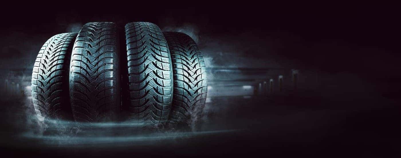Four tires are shown lined up.
