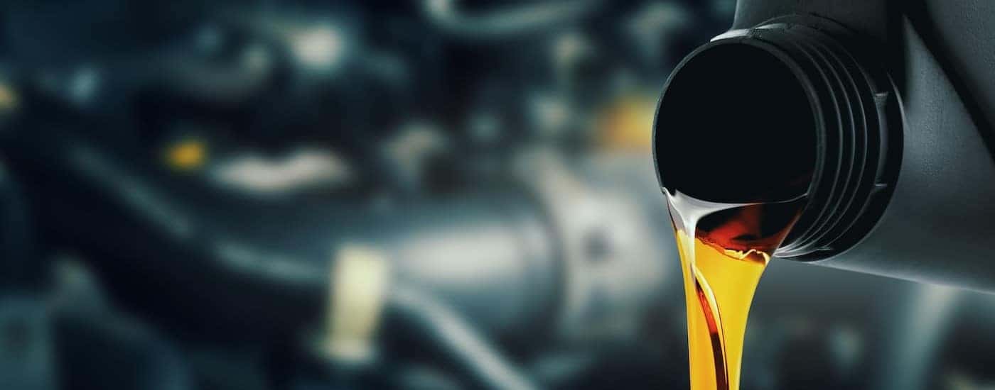 Oil is shown being poured from a container at a Toyota service center near Lockport.