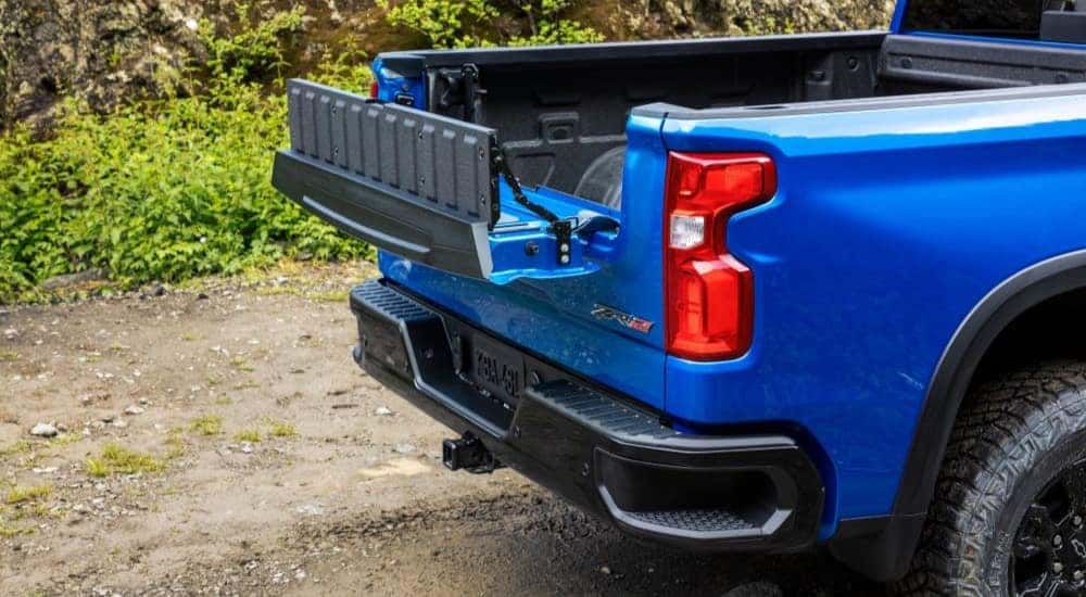 A close up shows the tailgate on a blue 2023 Chevy Silverado 1500 ZR2.