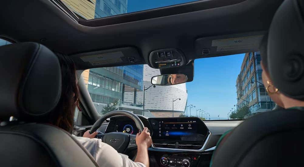 The black interior and dash are shown in a 2025 Chevy Trax for sale.